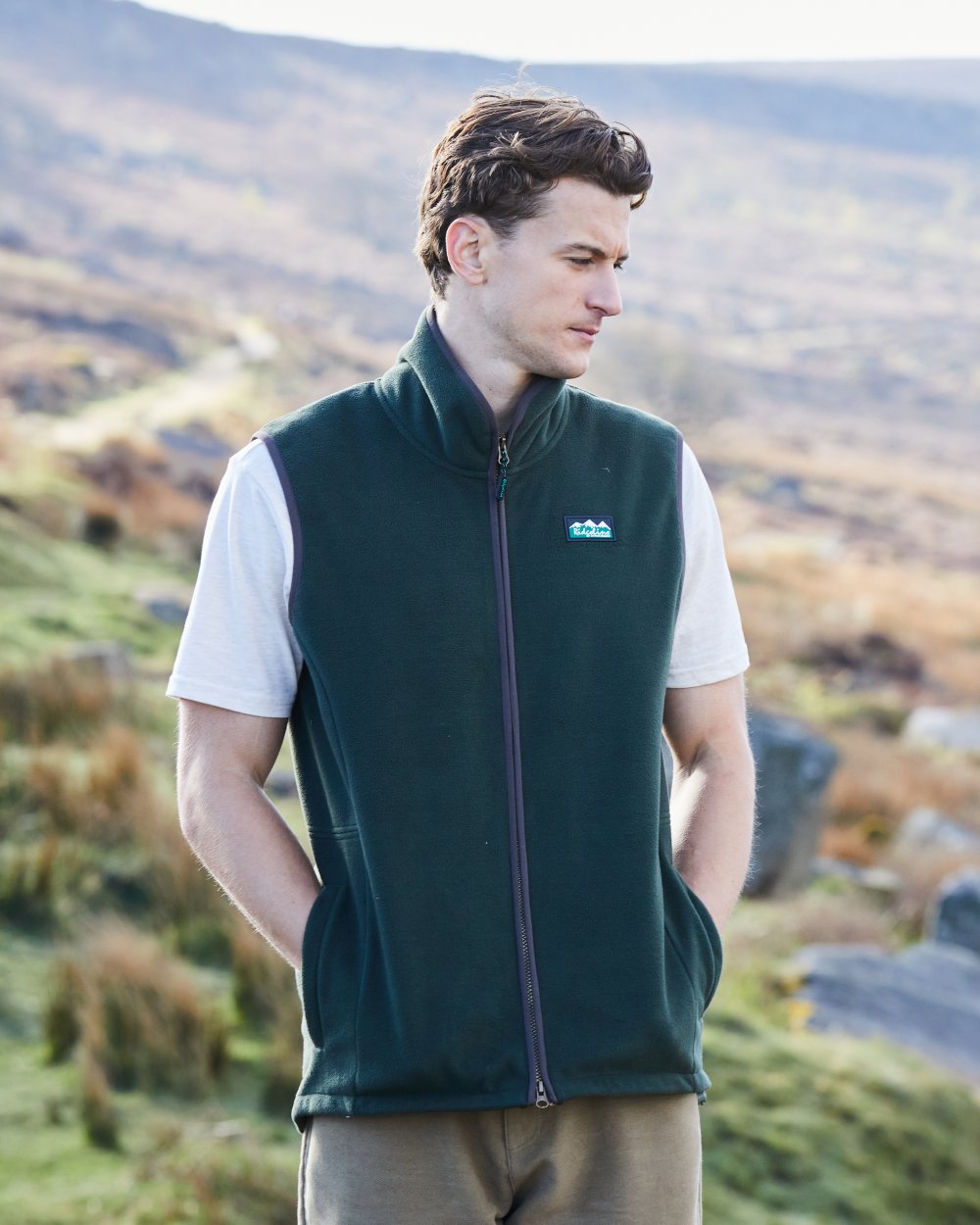 Deep Forest Coloured Ridgeline Mens Kodiak Gilet on hilly background