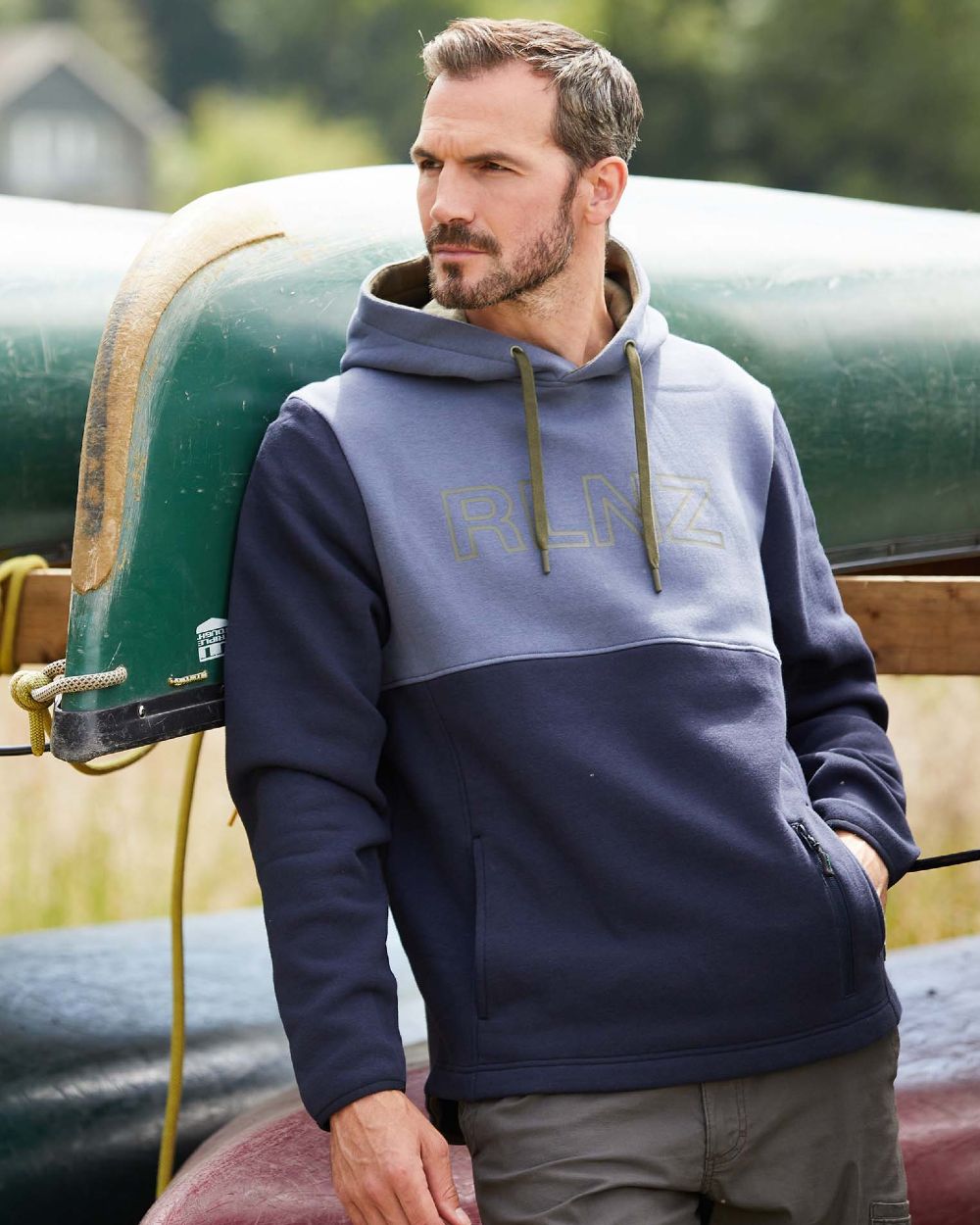 Navy coloured Ridgeline Mens South Island Hoodie on blur background