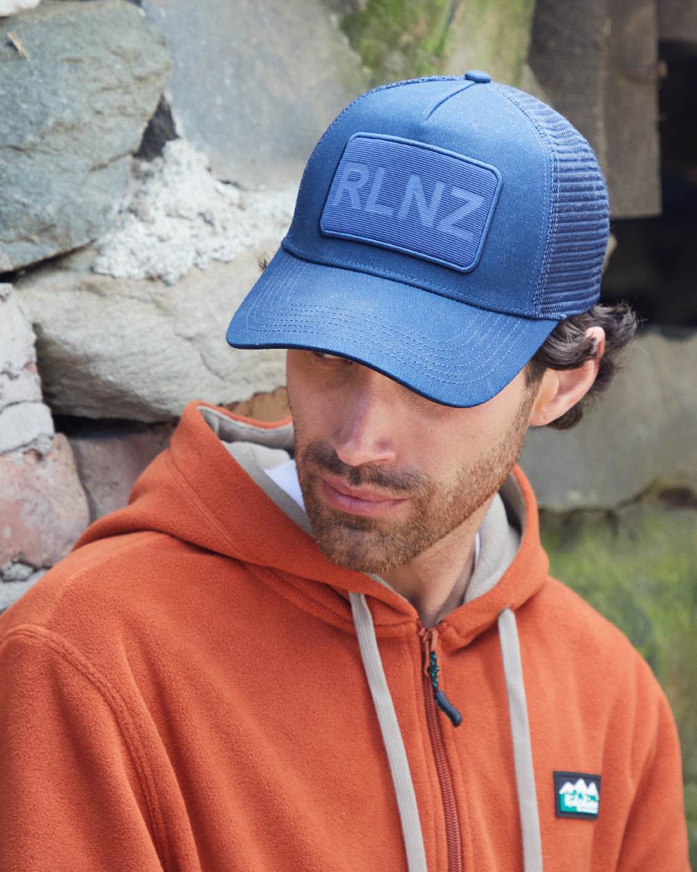 Navy Coloured Ridgeline RLNZ Trucker Cap on outdoor background
