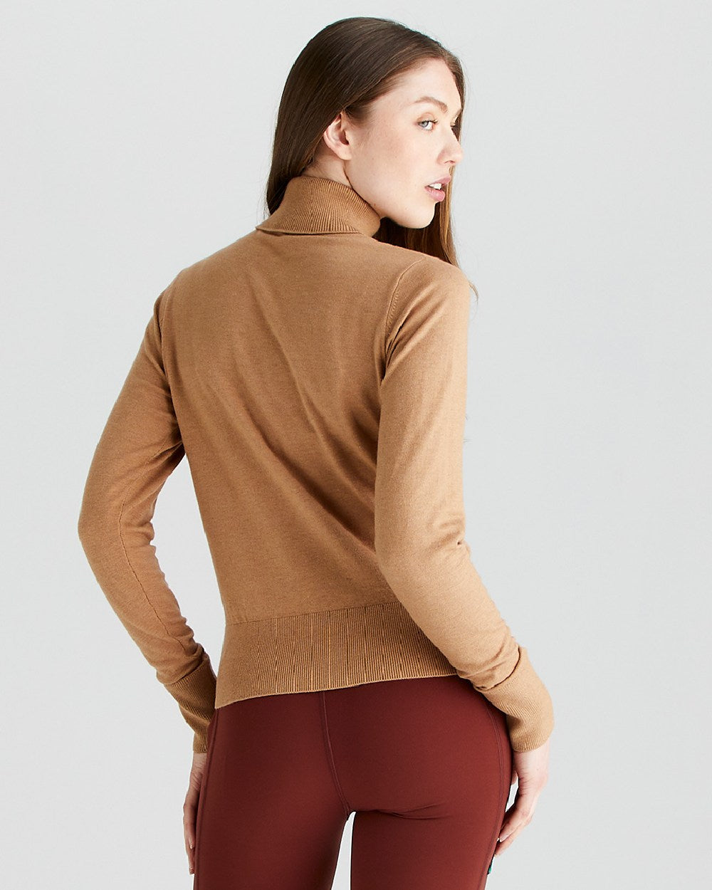 Sienna coloured Ridgeline Womens Melford Knit Roll Neck Jumper on grey background