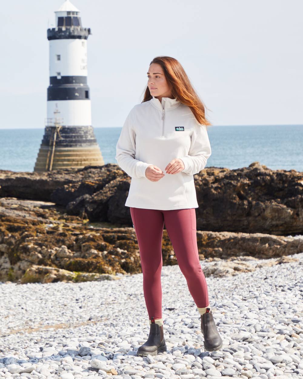 Winter Berry Coloured Ridgeline Womens Infinity Leggings On A Beach Background