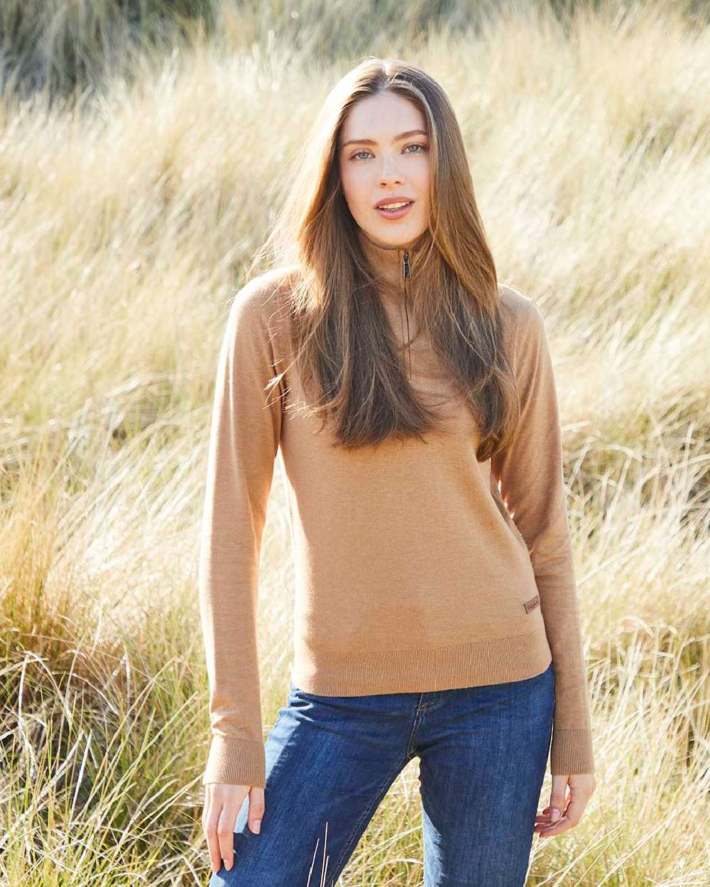 Sienna coloured Ridgeline Womens Melford Knit 1/4 Zip Jumper on field background