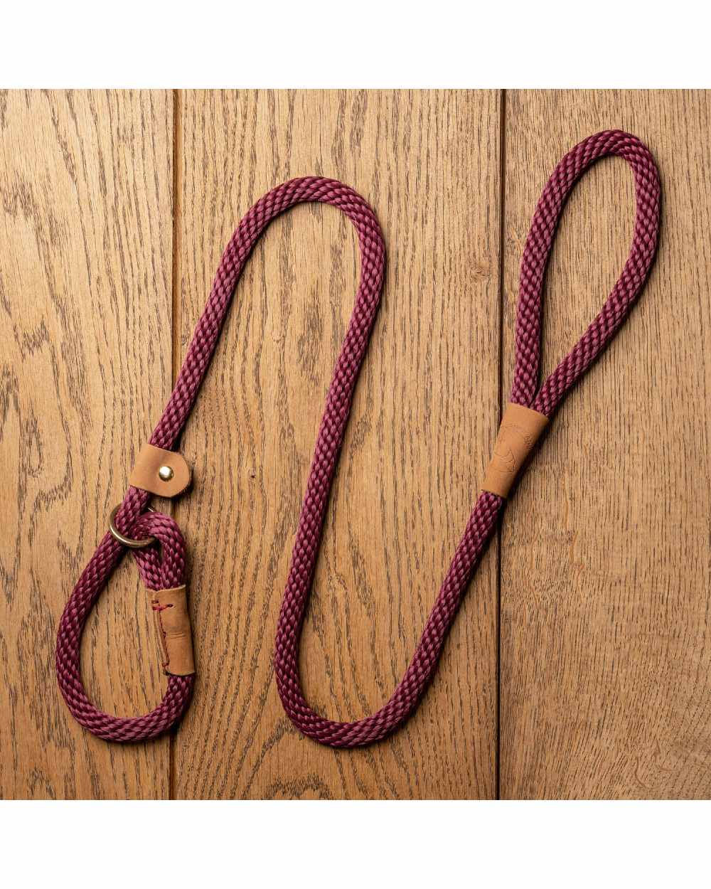 Burgundy coloured Ruff &amp; Tumble Slip Dog Leads on wooden background 