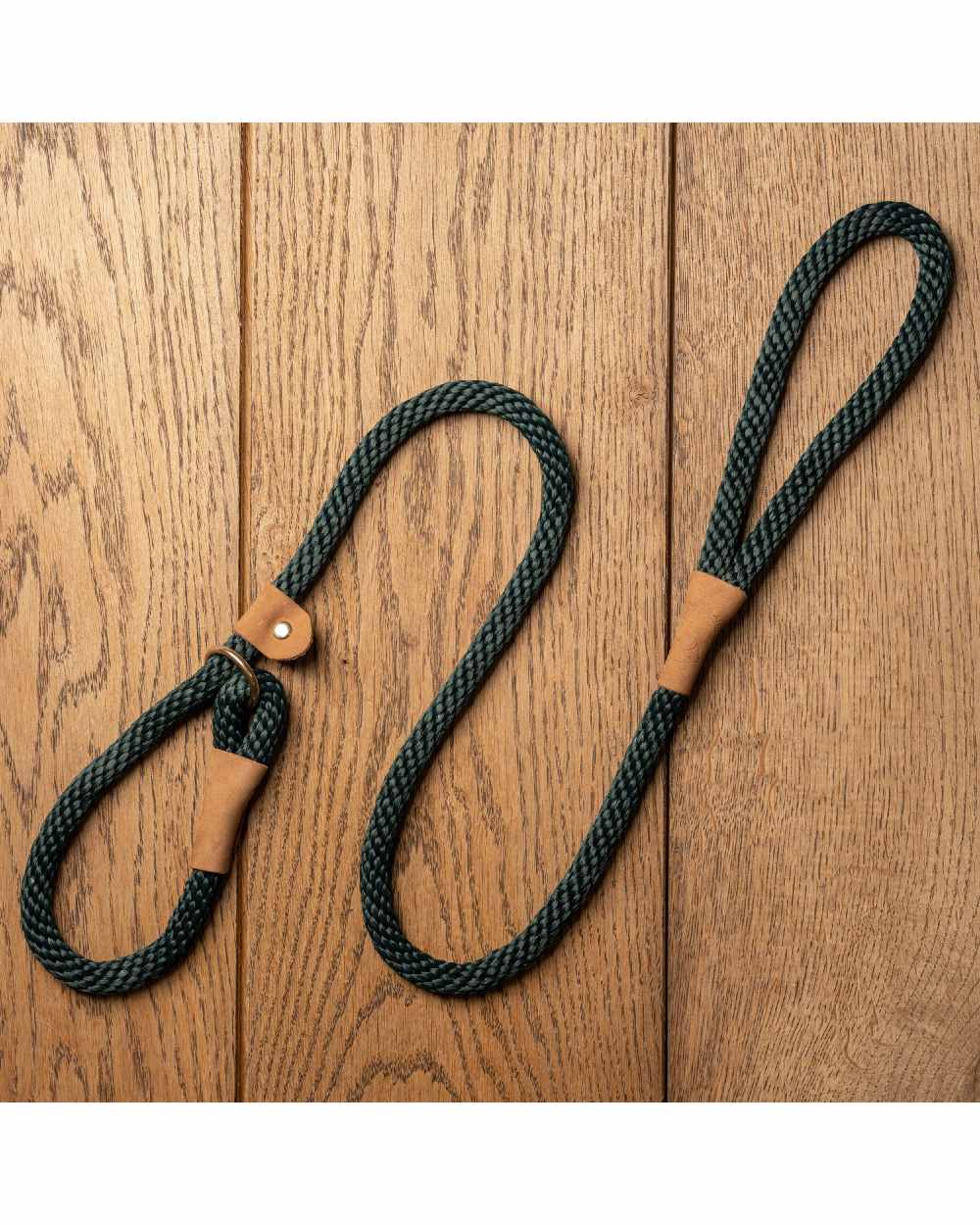 Forest coloured Ruff &amp; Tumble Slip Dog Leads on wooden background 