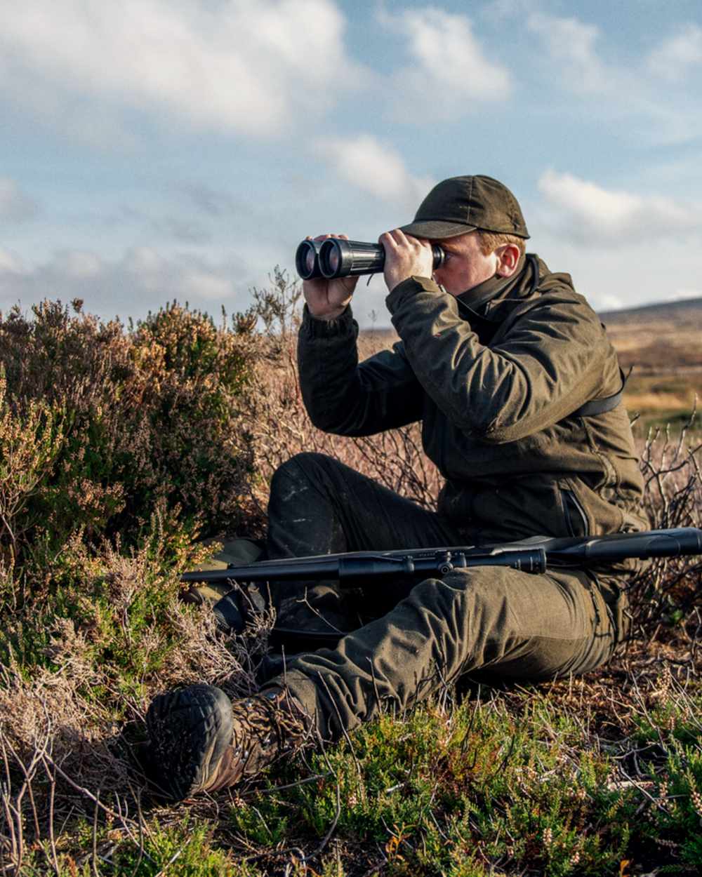 Pine Green Melange coloured Seeland Avail Jacket on forest background