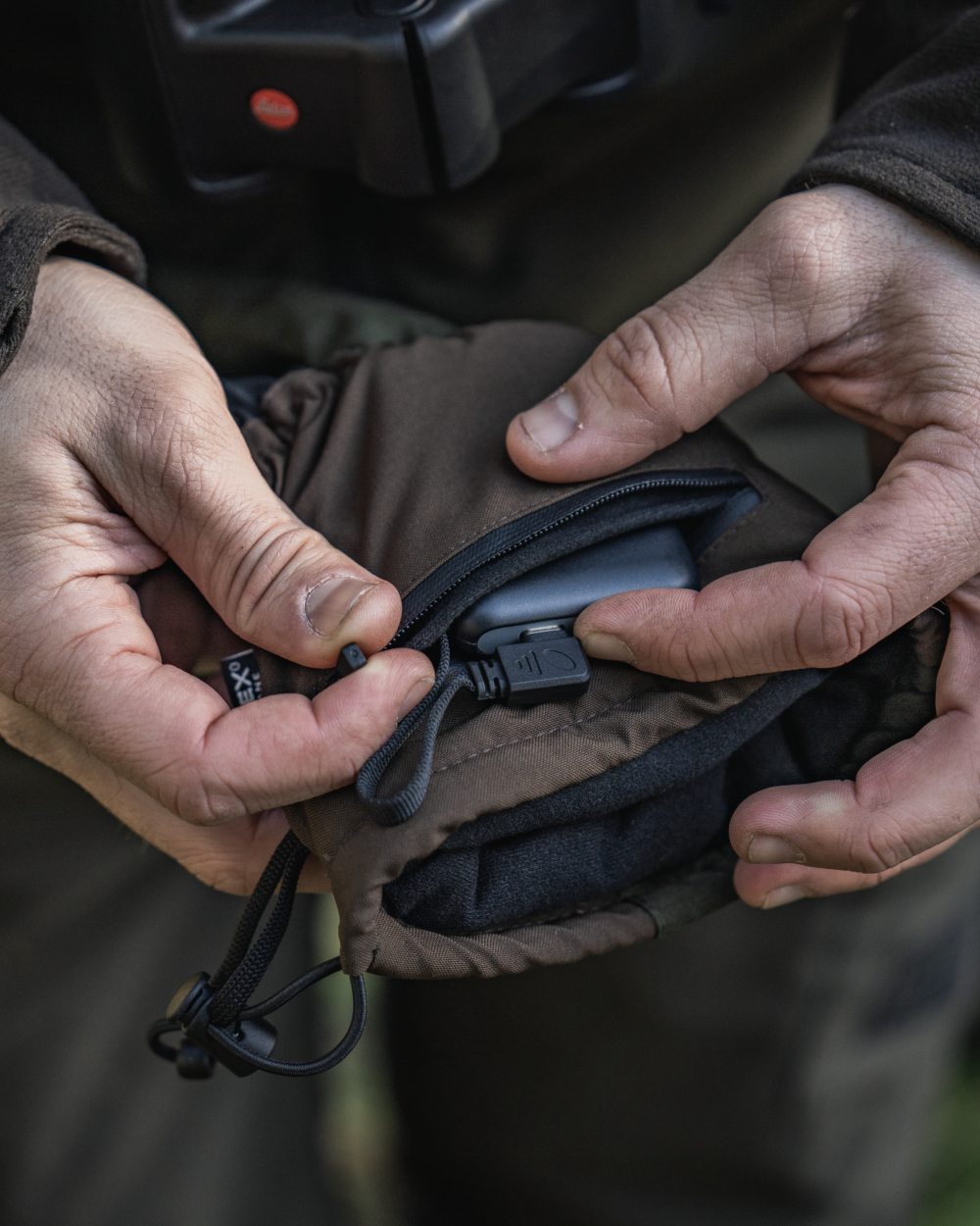 Pine Green coloured Seeland Celsius Heat Gloves on forest background