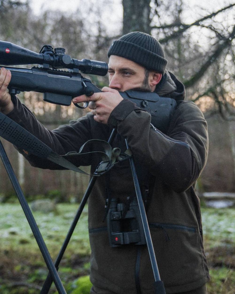 Pine Green Coloured Seeland Chaser Jacket on forest background