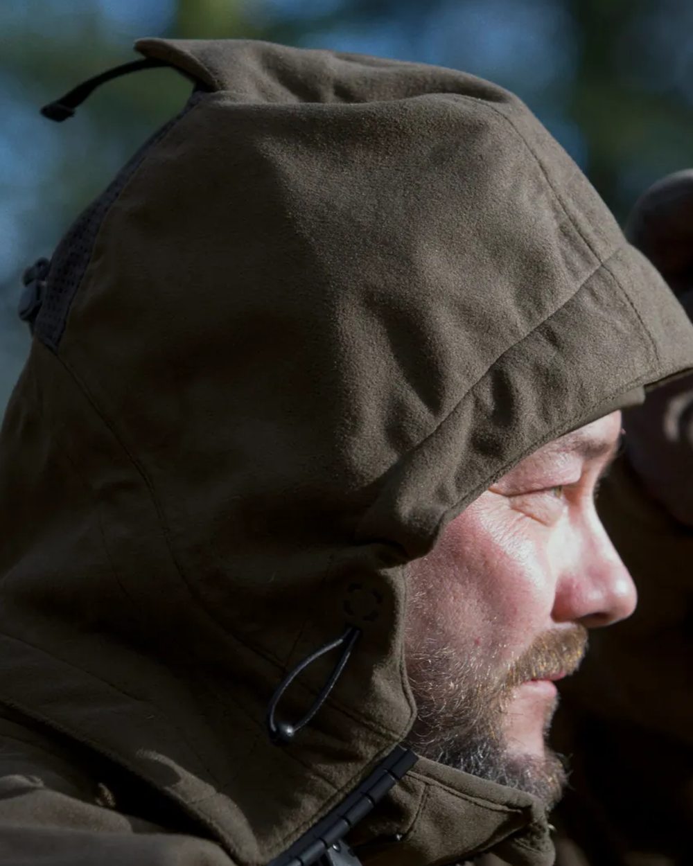 Pine Green Coloured Seeland Climate Hybrid Jacket on outdoor background