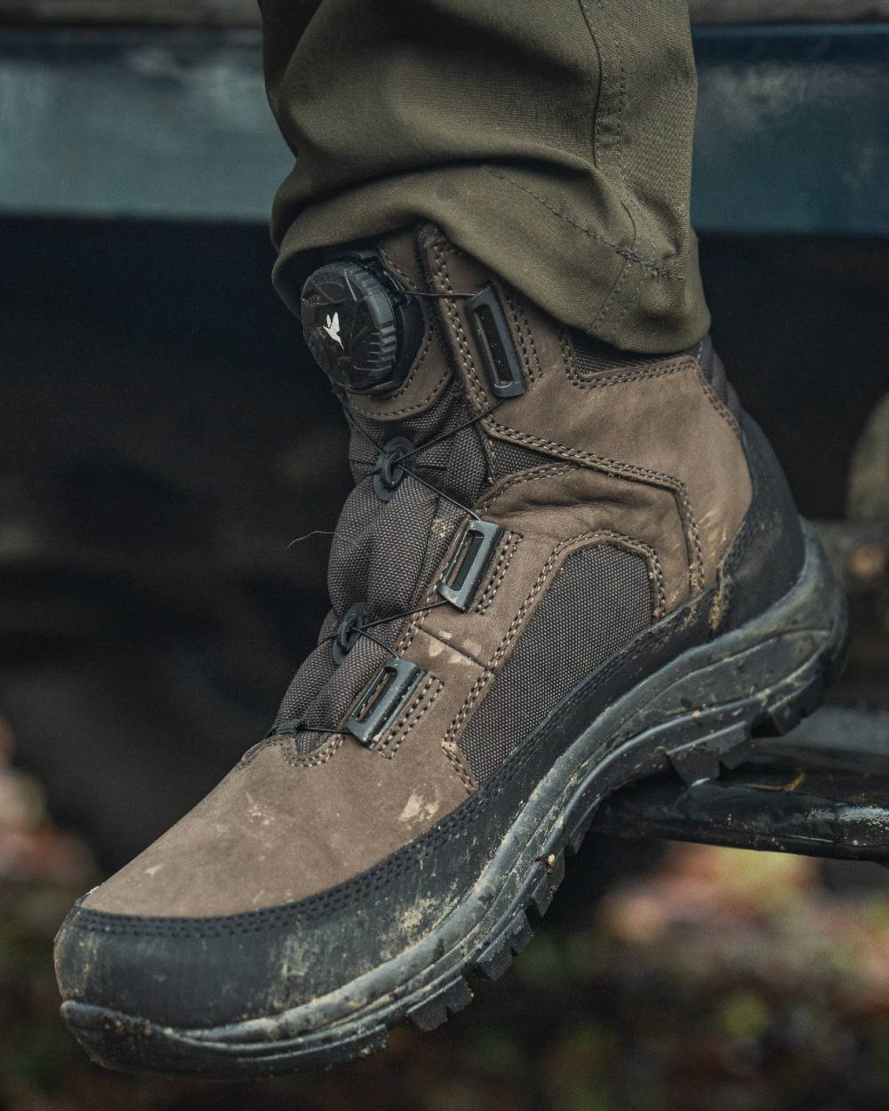 Dark Brown coloured Seeland Enduro Dial Mid Boots on forest background