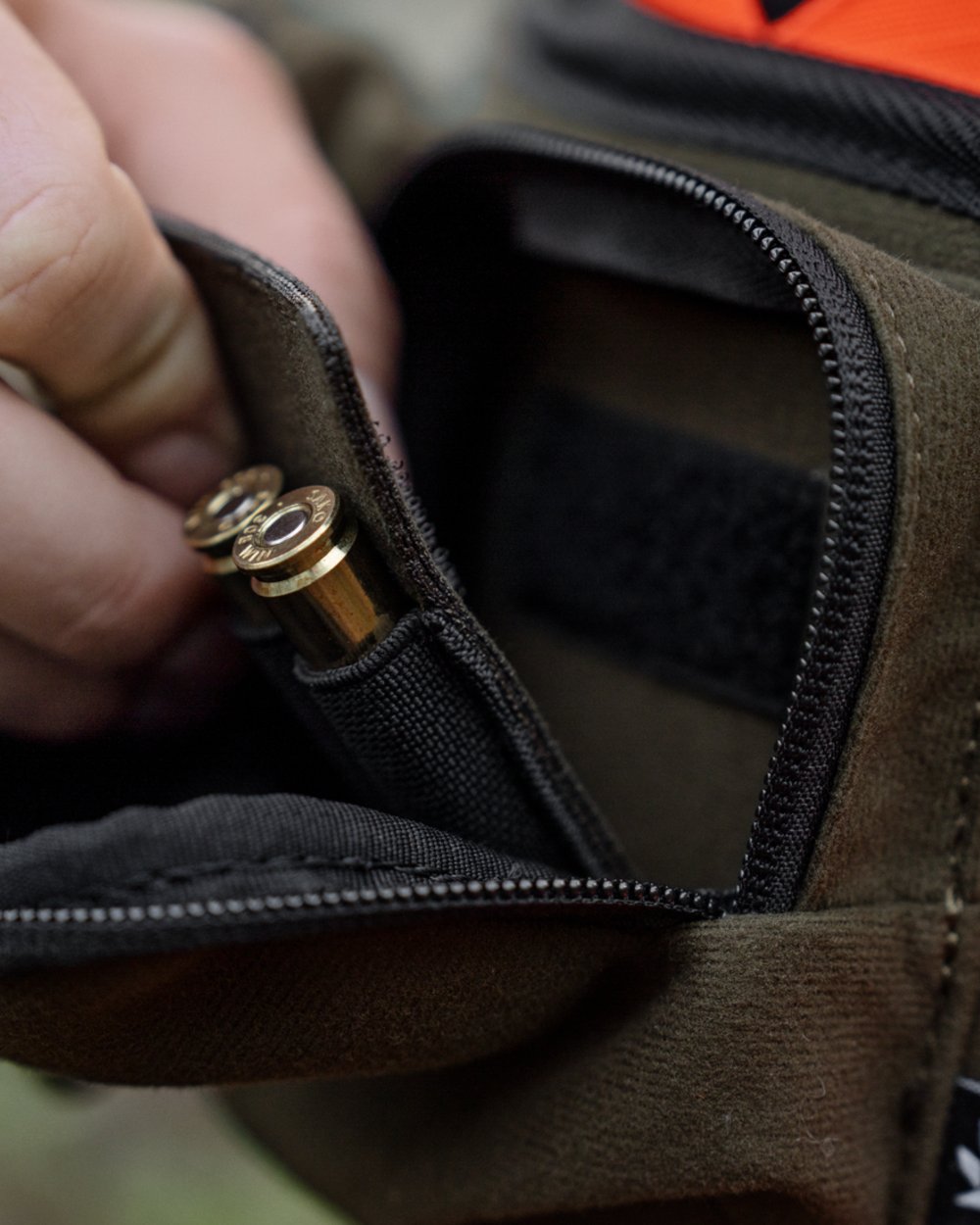 Pine Green coloured Seeland Enduro Utility Waist Pack on forest background