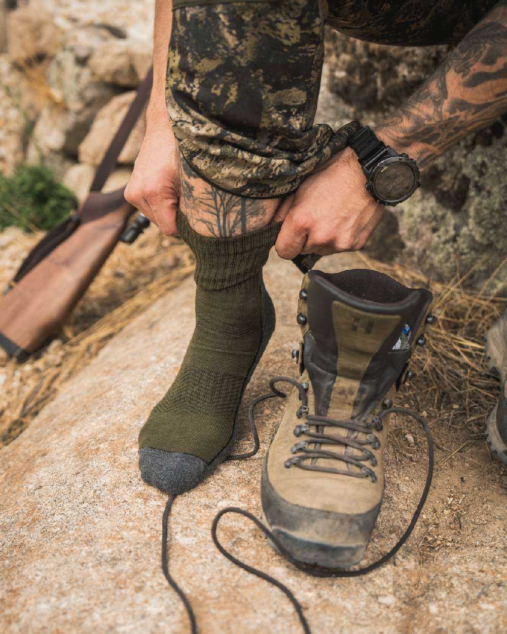 Pine Green Dark Grey Coloured Seeland Field Sock Triple Pack on Blurry Background