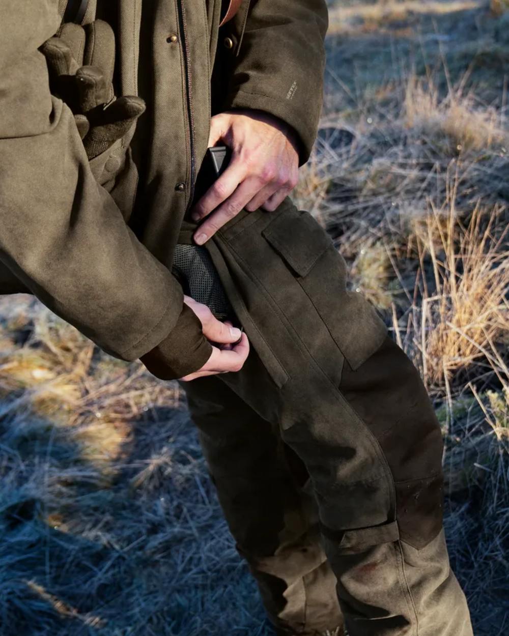 Grizzly Brown Coloured Seeland Helt II Waterproof Trousers on outdoor background