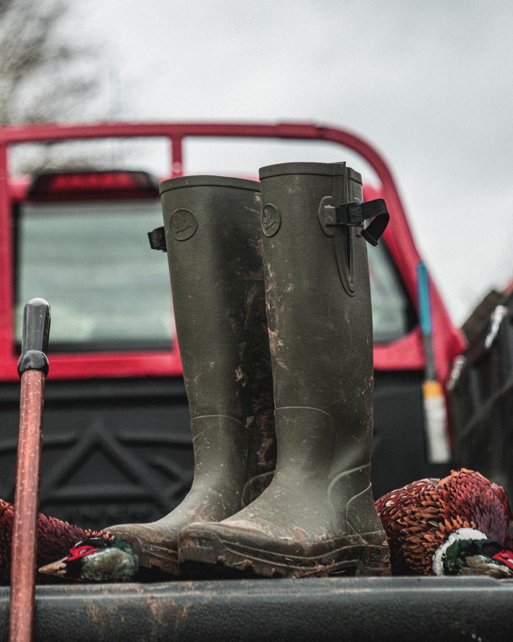 Pine Green Coloured Seeland Hillside Classic Boots on outdoor background