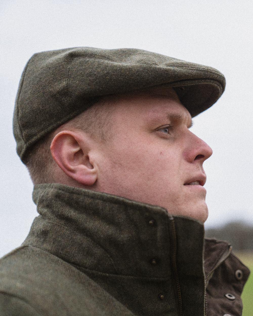 Moss Green Coloured Seeland Hillside Sixpence Cap on outdoor background