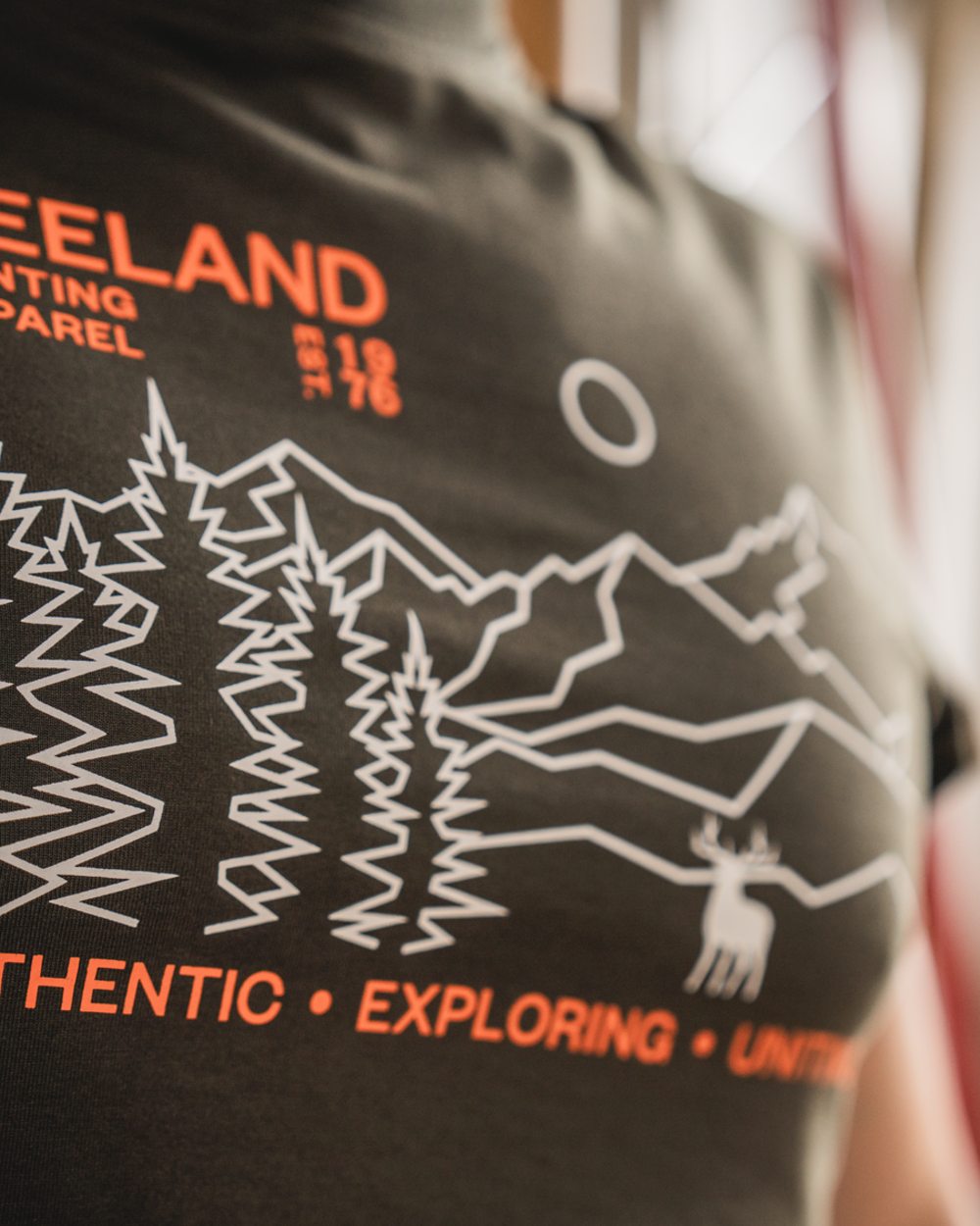Pine Green Coloured Seeland Landscape T-Shirt on outdoor background