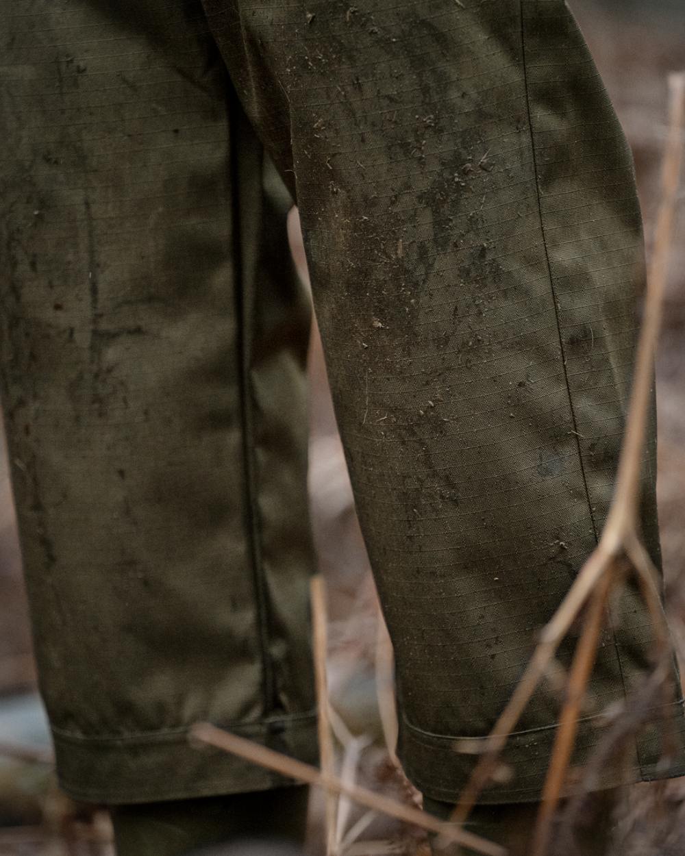 Shaded Olive coloured Seeland Mens Buckthorn Duro Treggings on forest background