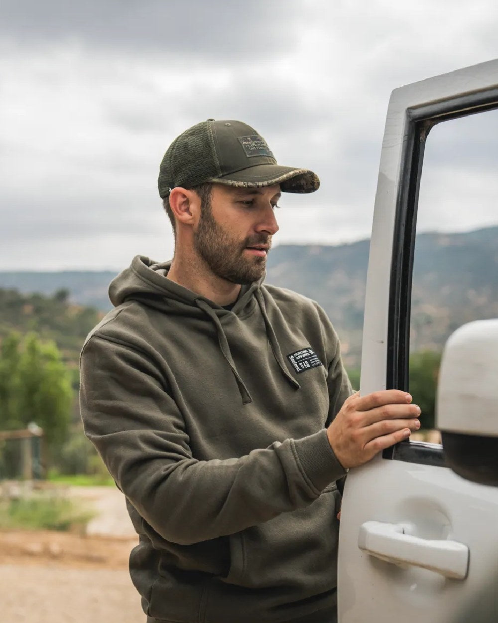 Grape Leaf Coloured Seeland Delta Hoodie on Outdoor Background