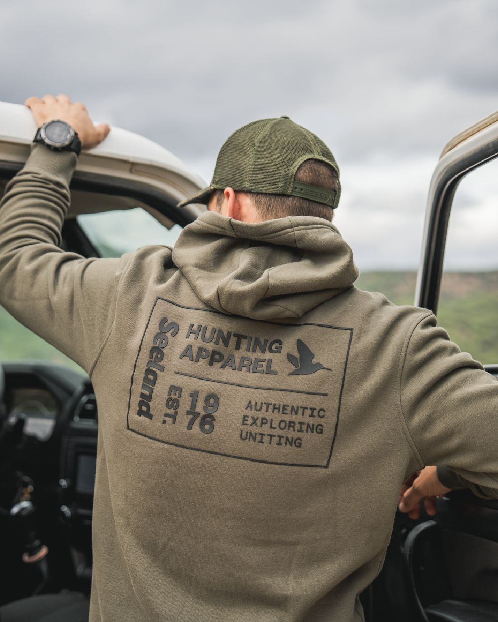 Grape Leaf Coloured Seeland Delta Hoodie on Outdoor Background