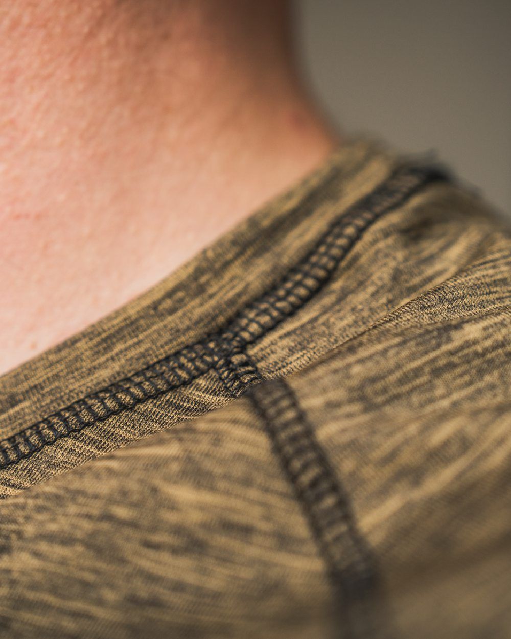 Military Olive Melange Coloured Seeland Peak T-shirt on Blurry Background