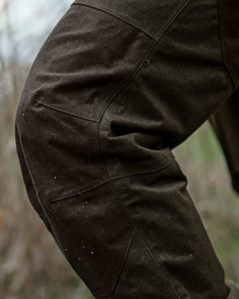 Pine Green Melange coloured Seeland Mens Quest Trousers on forest background