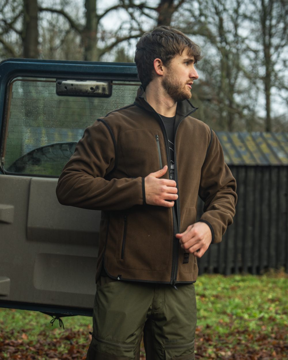 Grizzly Brown Demitasse Brown Coloured Seeland Mens Rogue Solid Reversible Fleece Jacket on forest background