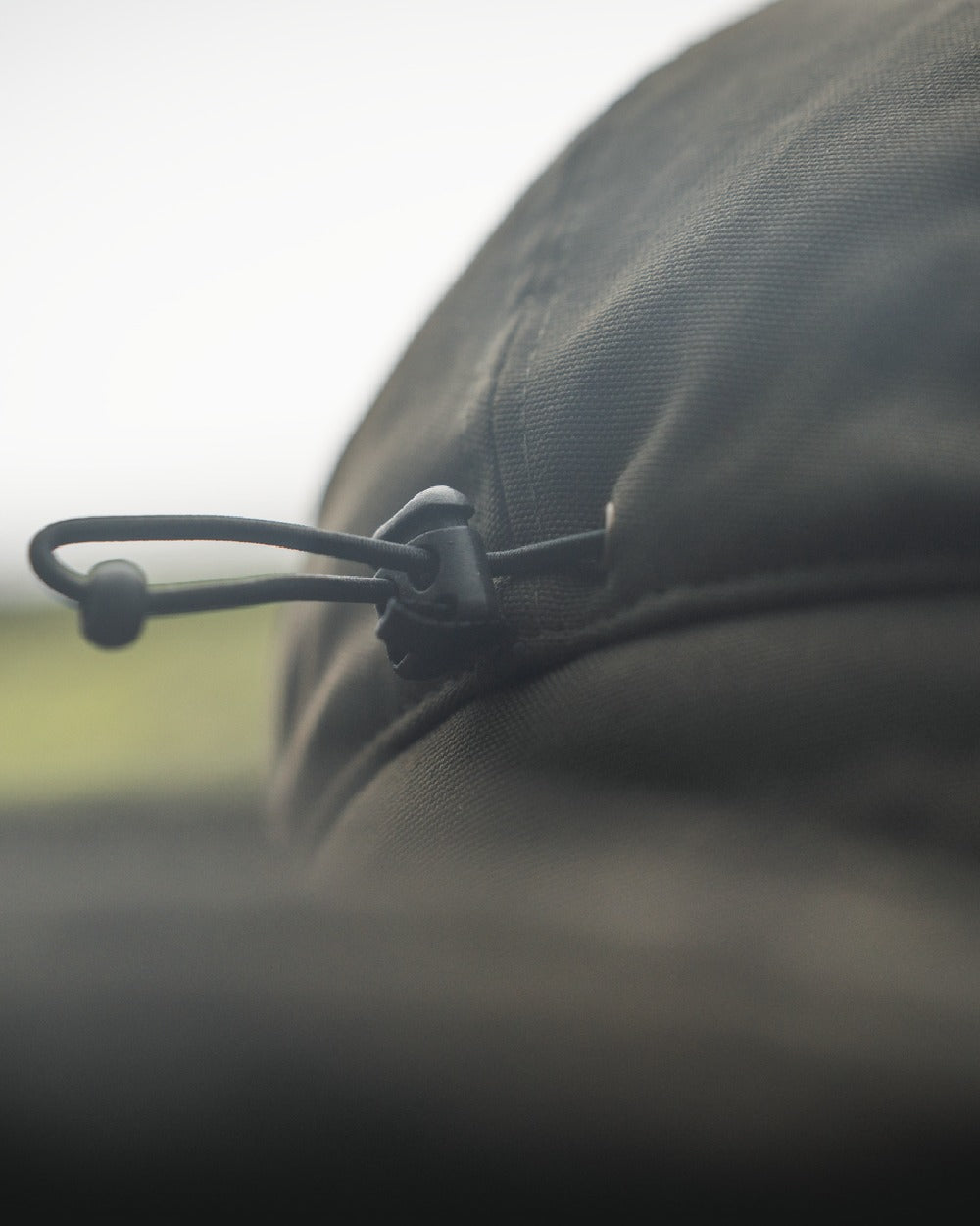 Pine Green coloured Seeland Mens Teddy Fold Down Cap on fog background