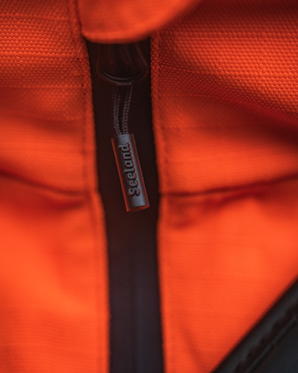 Orange Blaze Coloured Seeland Mens Venture Serac Jacket on outdoor background