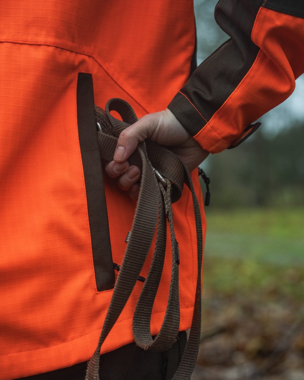 Orange Blaze Coloured Seeland Mens Venture Serac Jacket on outdoor background
