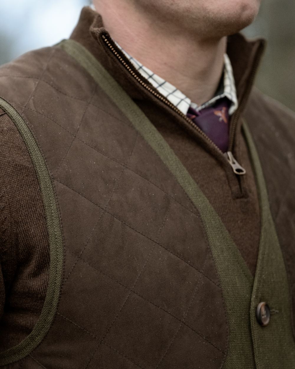 Shaded Olive coloured Seeland Mens Woodcock Royale Waistcoat on forest background