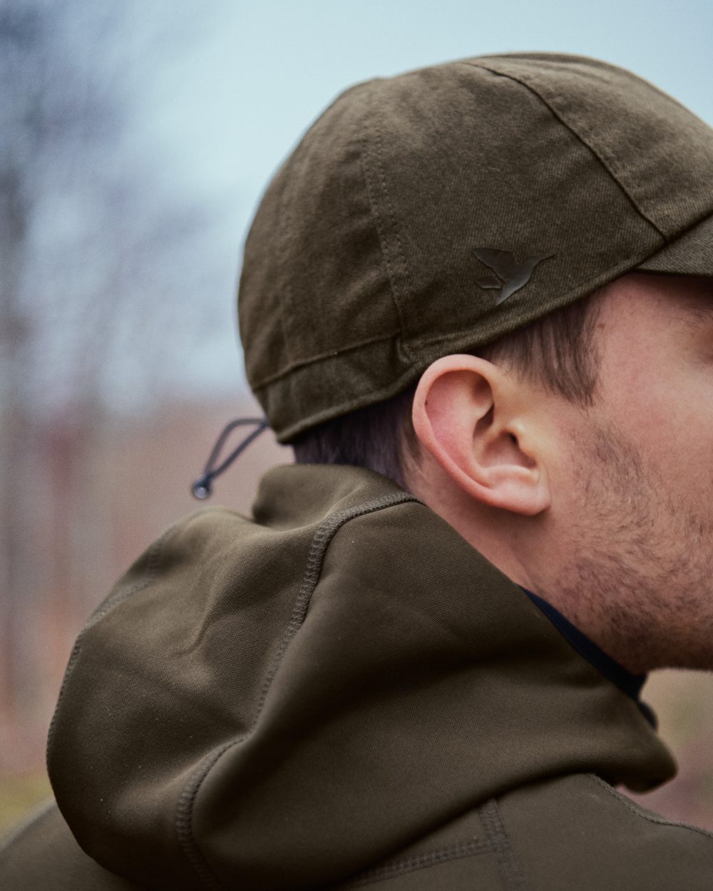 Pine Green coloured Seeland Power Fleece on forest background