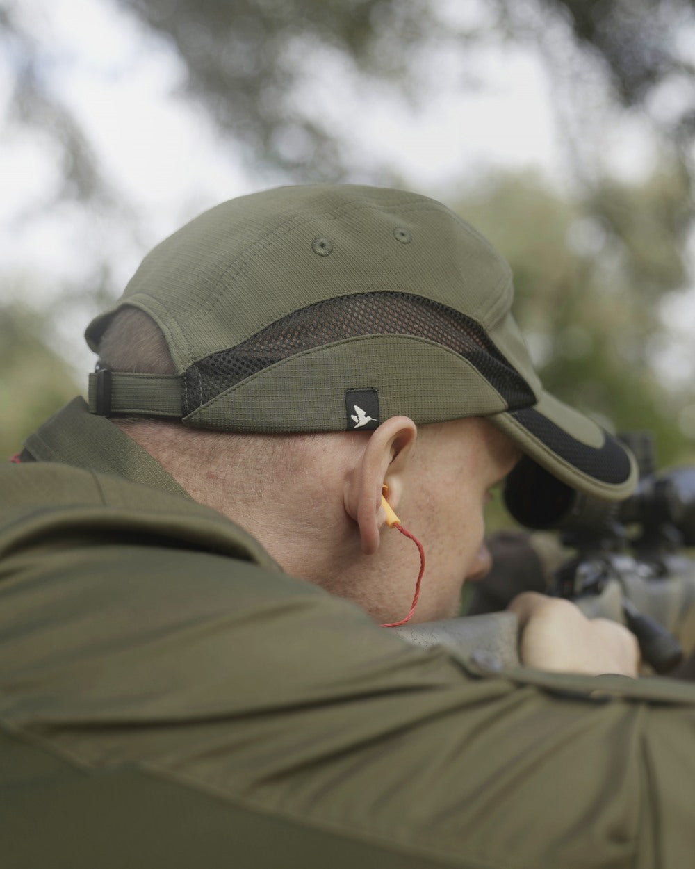 Grape Leaf Coloured Seeland Selous Cap on forest background