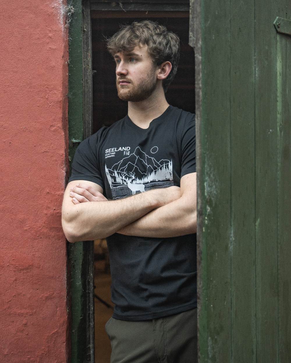 Black coloured Seeland Territory T-Shirt on outdoor background