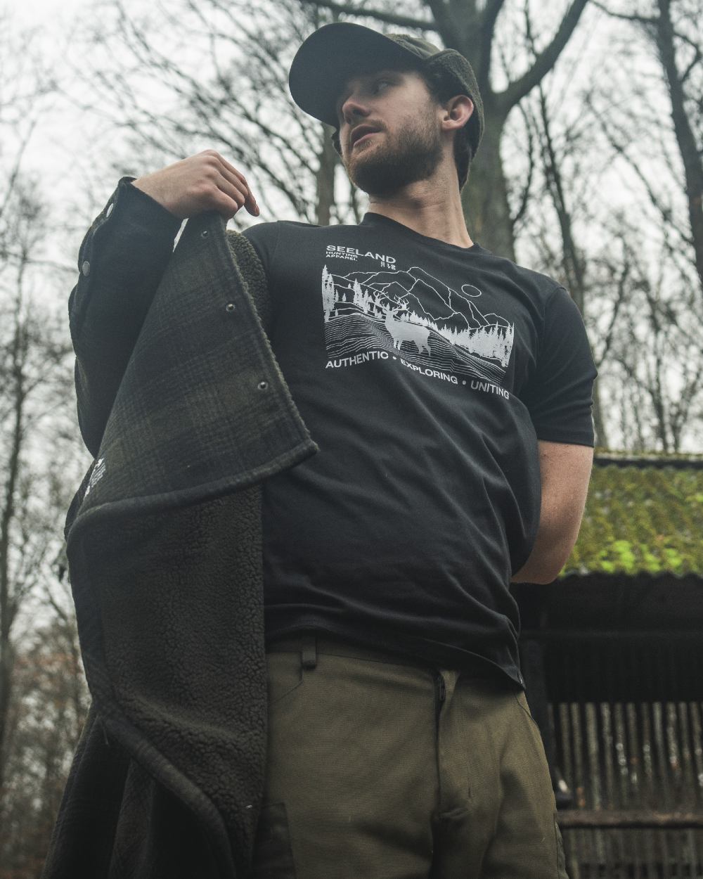 Black coloured Seeland Territory T-Shirt on forest background