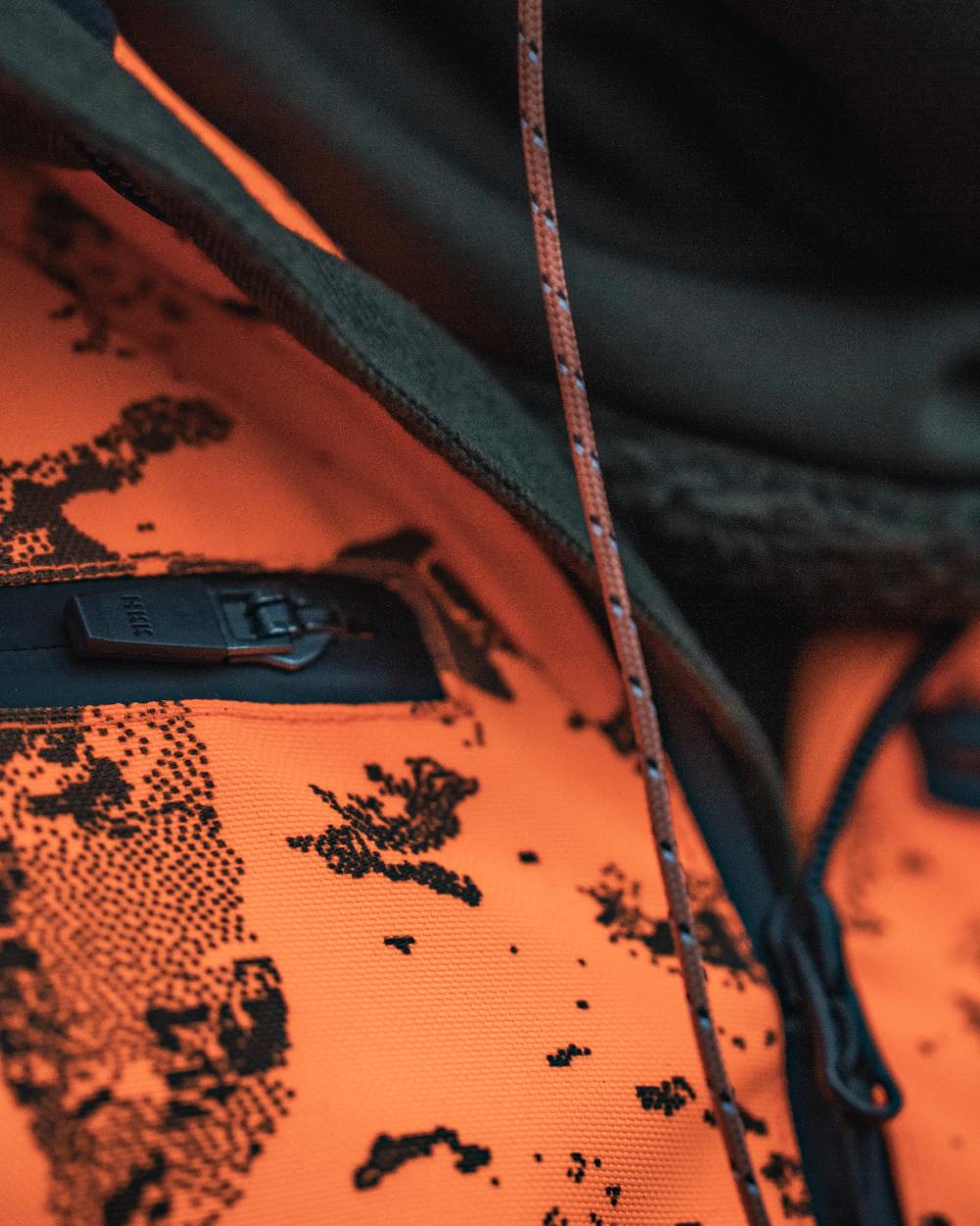 Orange Blaze InVis MPC coloured Seeland Trax Blaze Jacket on forest background