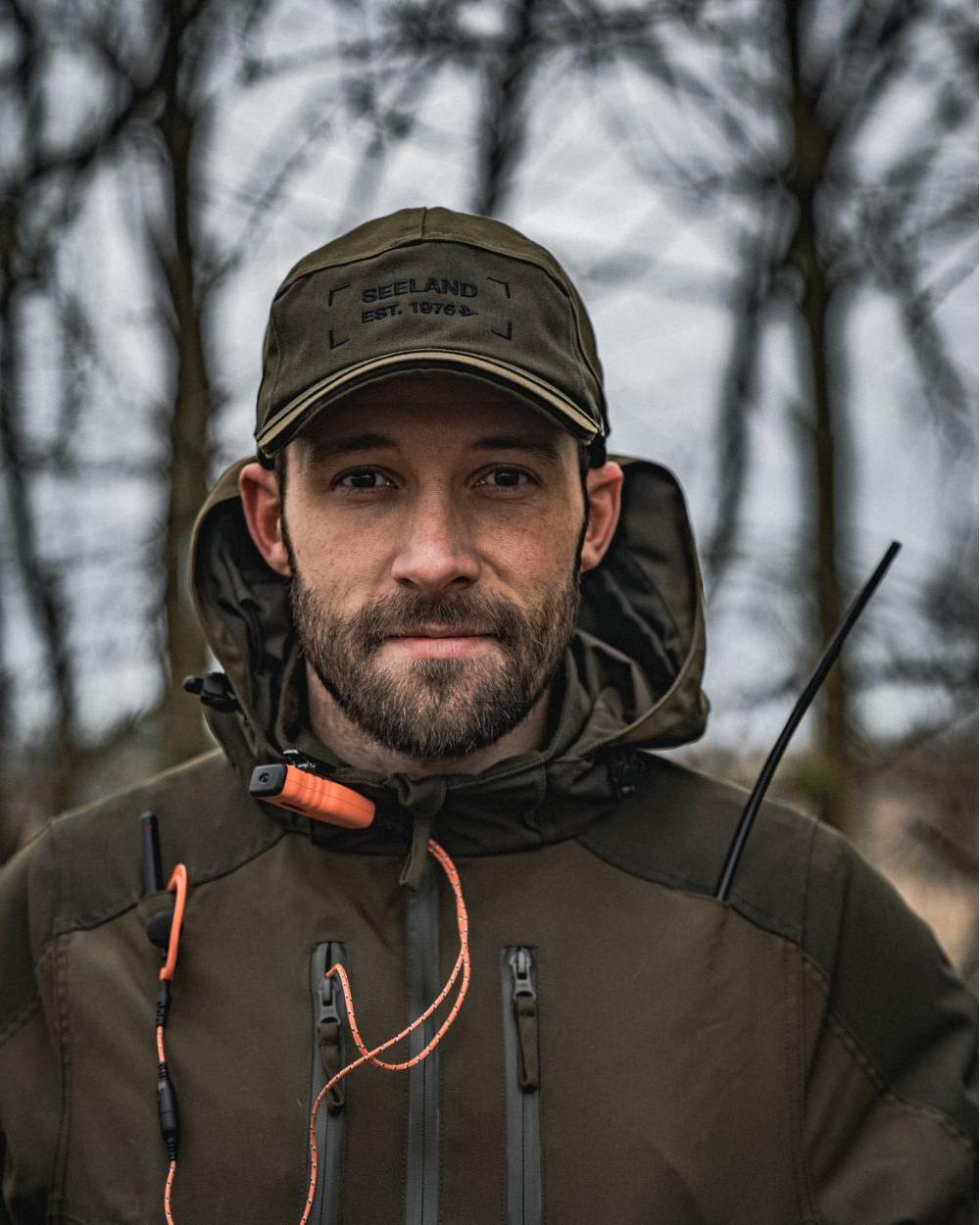 Light Pine Coloured Seeland Trax Cap on forest background