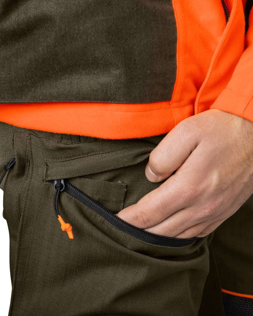 Pine Green Hi-Vis Orange Coloured Seeland Venture Trousers on white background