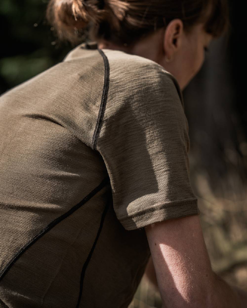 Covert Green Coloured Seeland Womens Apex Aia Merino T-shirt on outdoor background