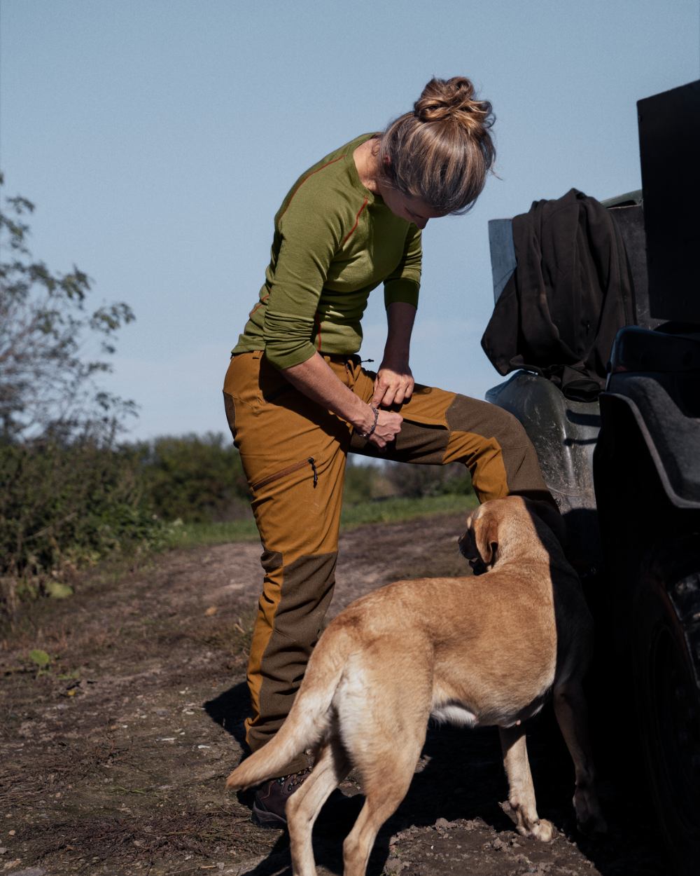 Burnt Clay coloured Seeland Womens Larch Membrane Trousers on forest background