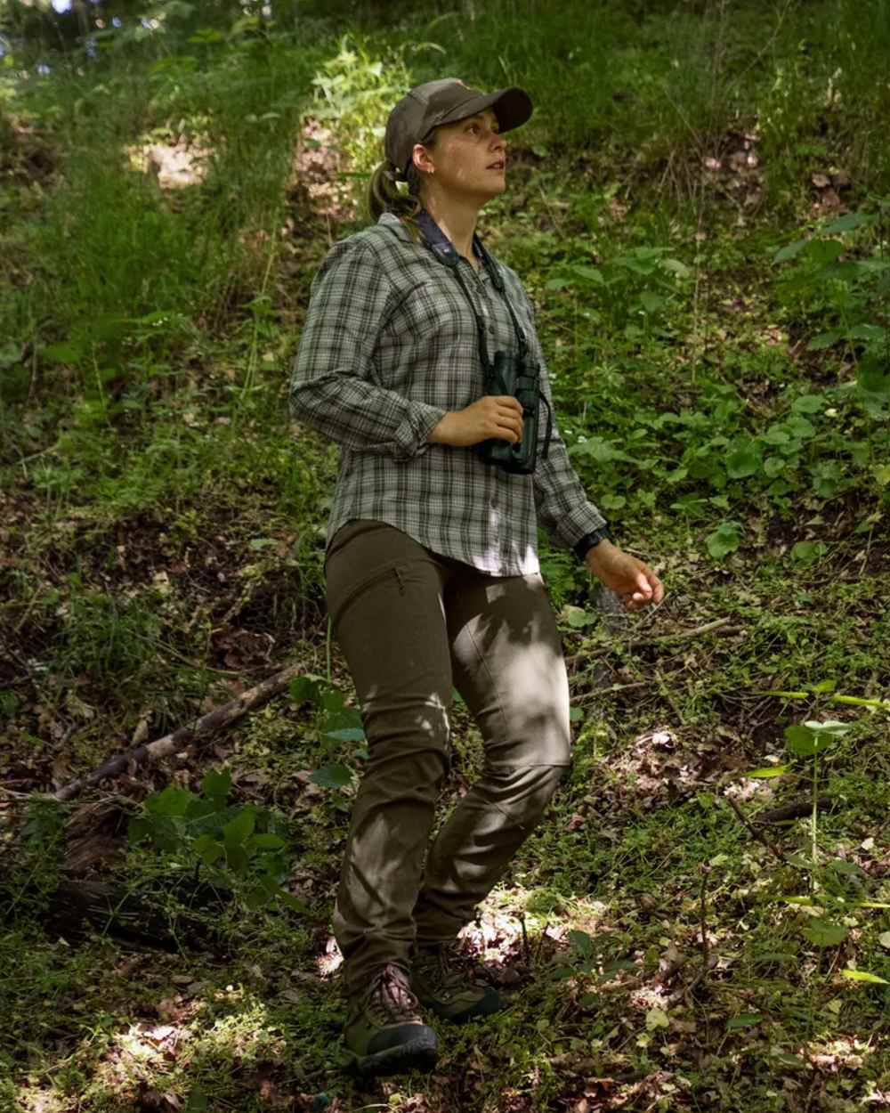 Pine Green coloured Seeland Womens Larch Stretch Trousers on forest background