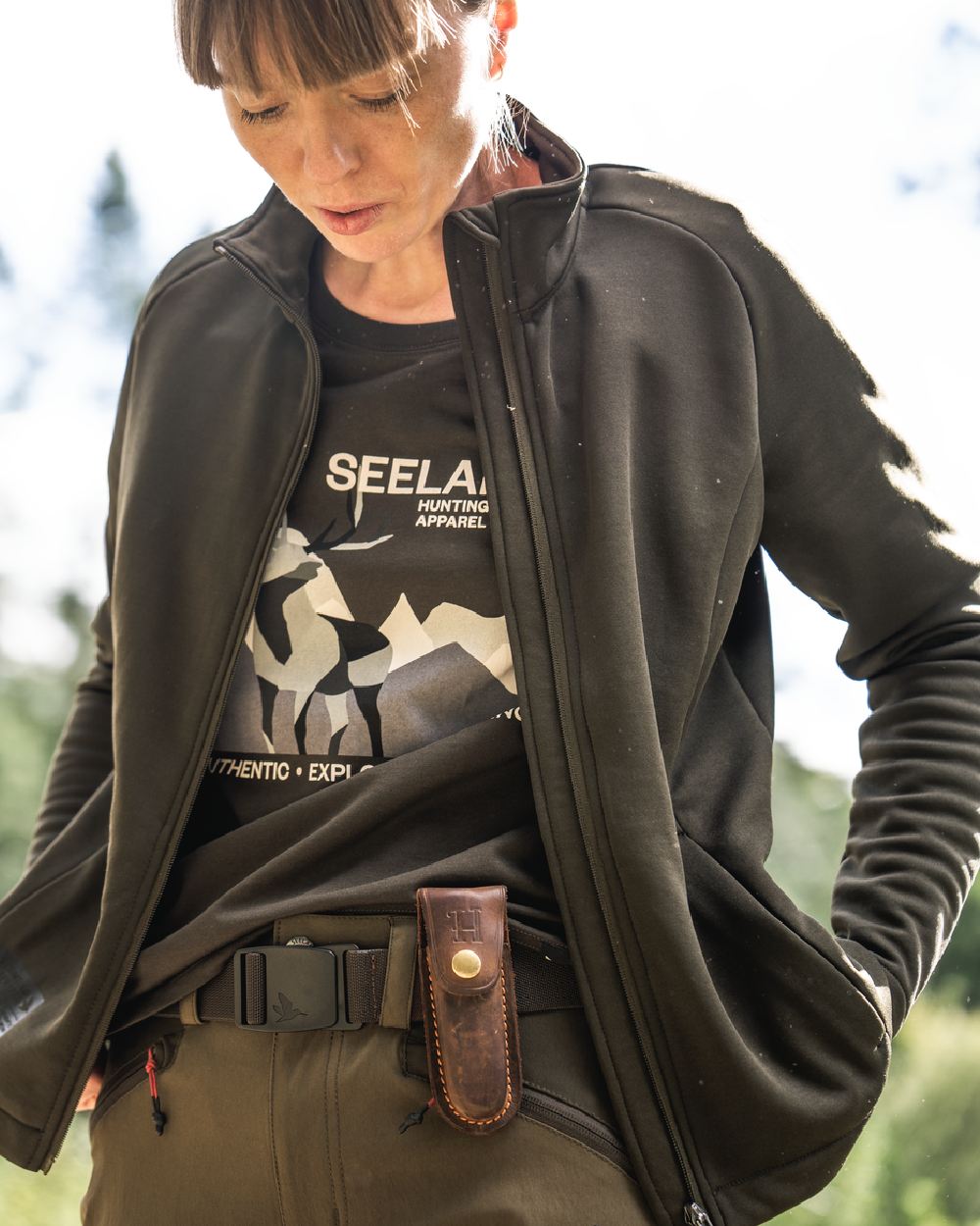 Pine Green Coloured Seeland Womens Sadie T-Shirt on blurry background