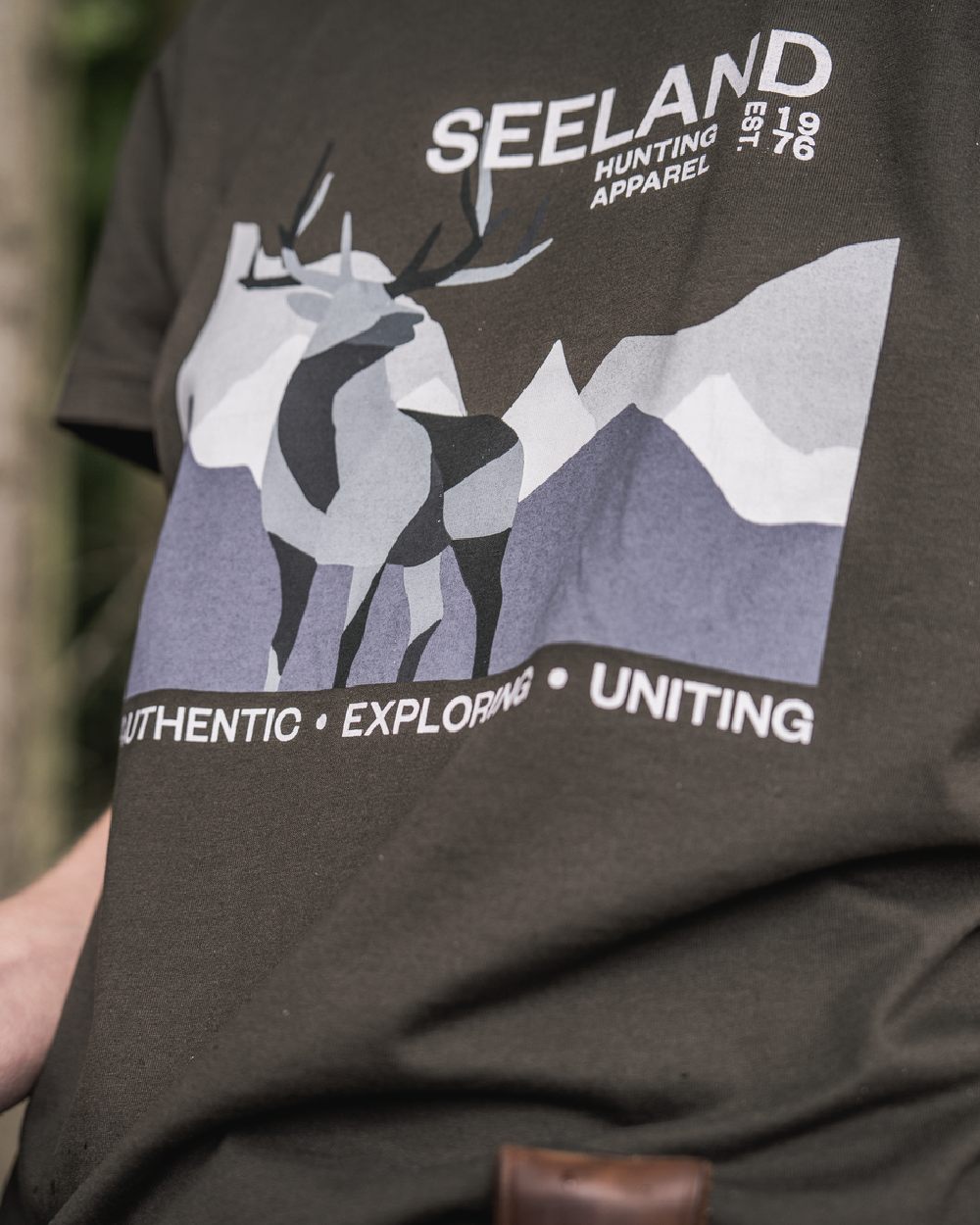 Pine Green Coloured Seeland Womens Sadie T-Shirt on blurry background