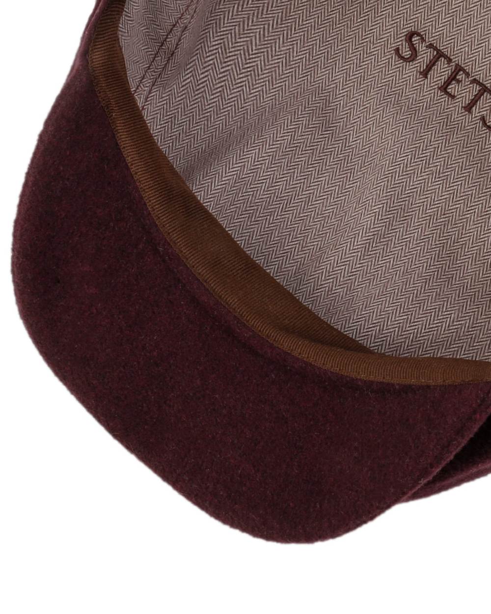 Burgundy coloured Stetson Hatteras Noir Cap on white background