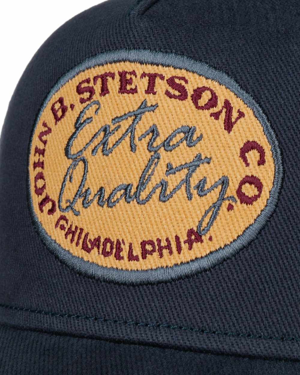 Blue coloured Stetson Vintage Brushed Twill Trucker Cap on white background