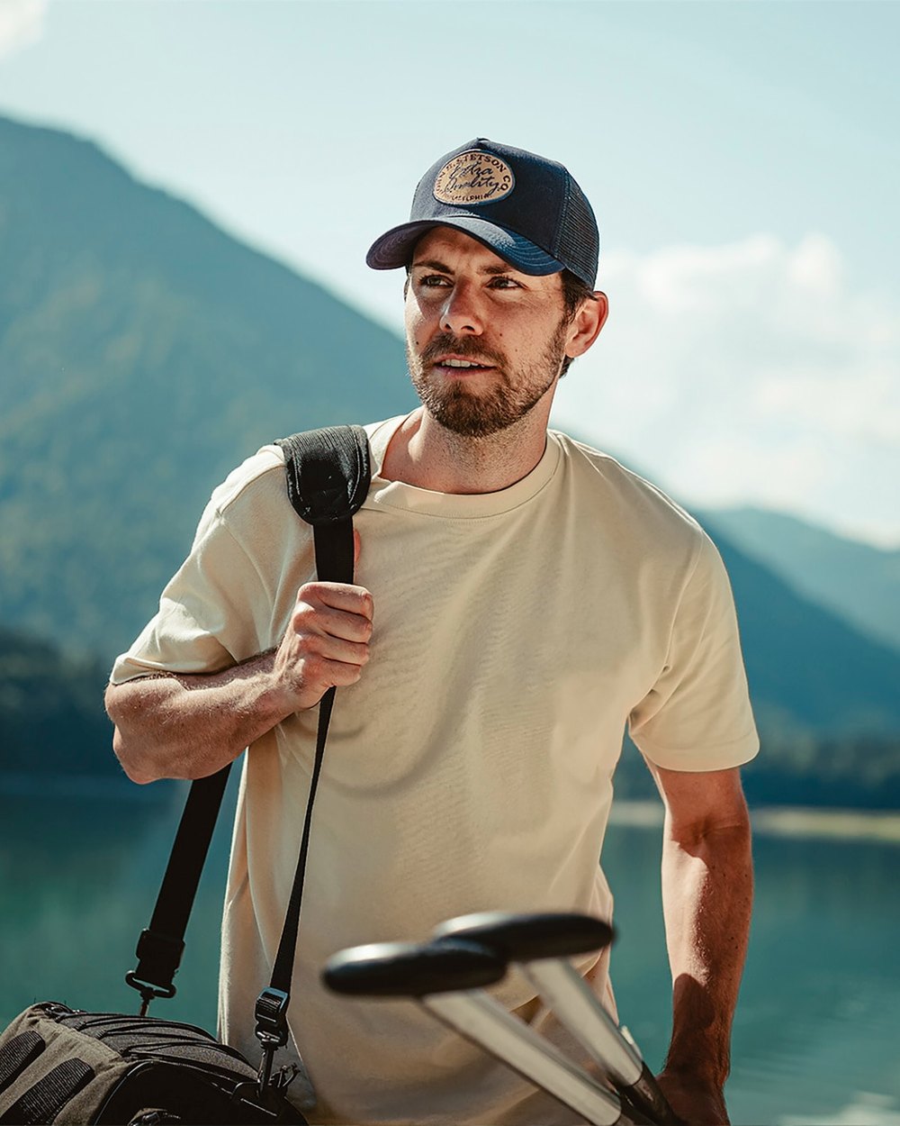 Blue coloured Stetson Vintage Brushed Twill Trucker Cap on blurry mountain background