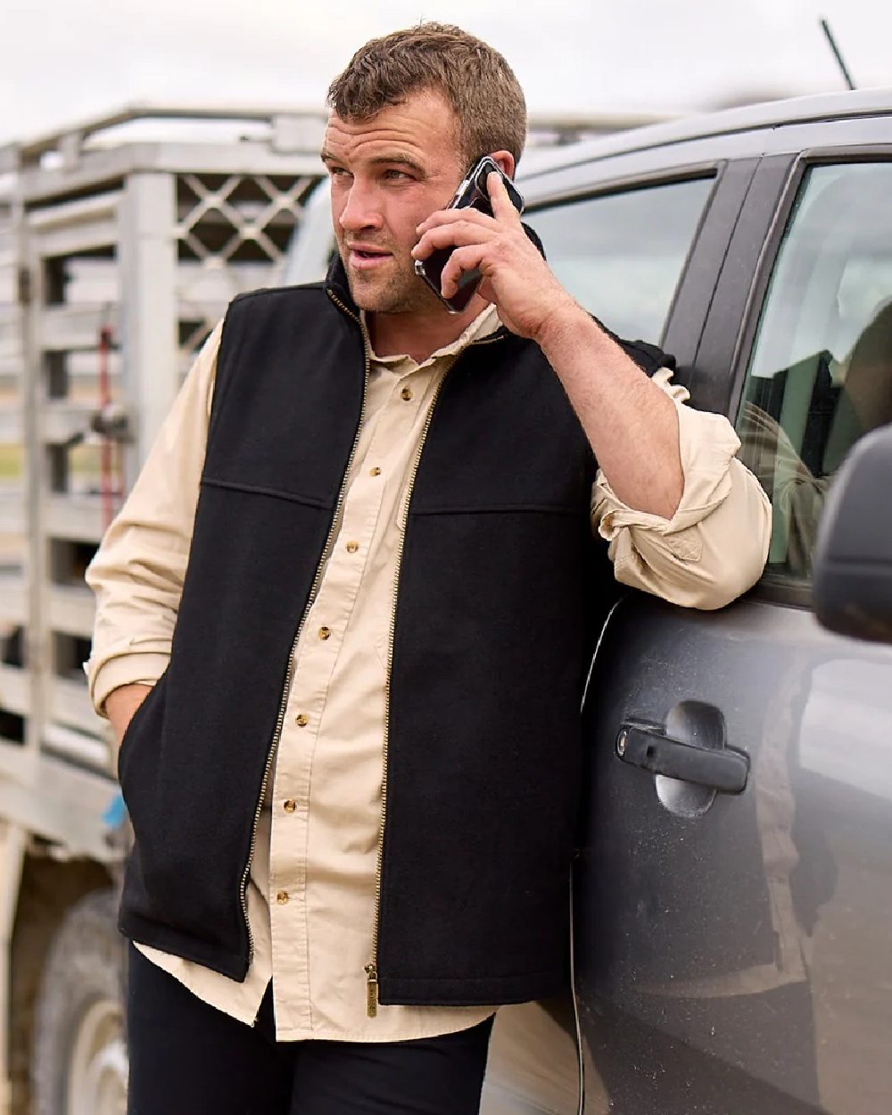 Black Coloured Swanndri Mens Saddleback Wool Vest on outdoor background