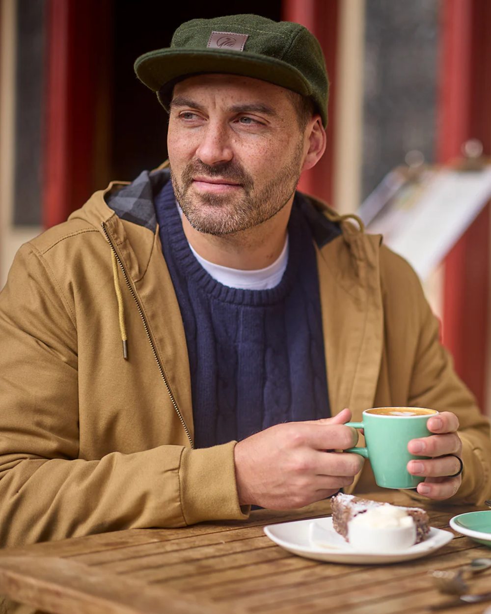 Cashew coloured Swanndri Mens Whitlow V2 Canvas Hoodie on outdoor background