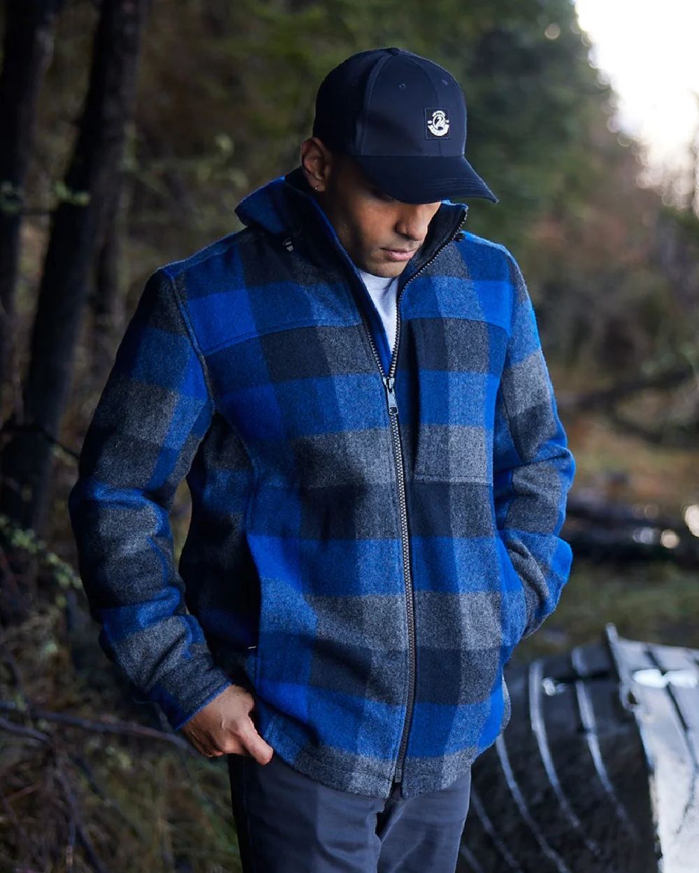 Navy Coloured Swanndri Swanni Baseball Cap on forest background