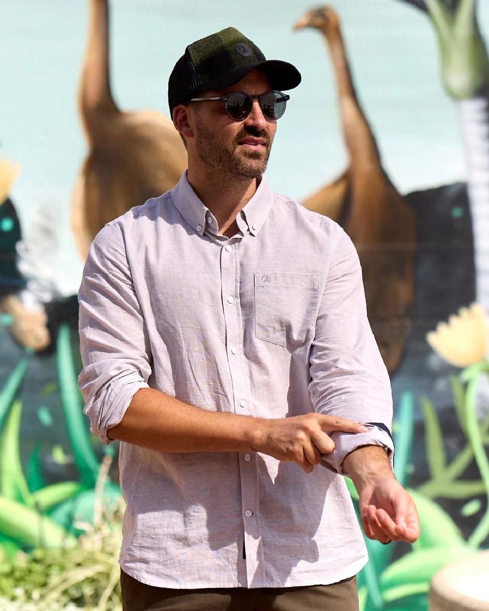 Olive Black Check Coloured Swanndri Swanni Trucker Cap on blurry background