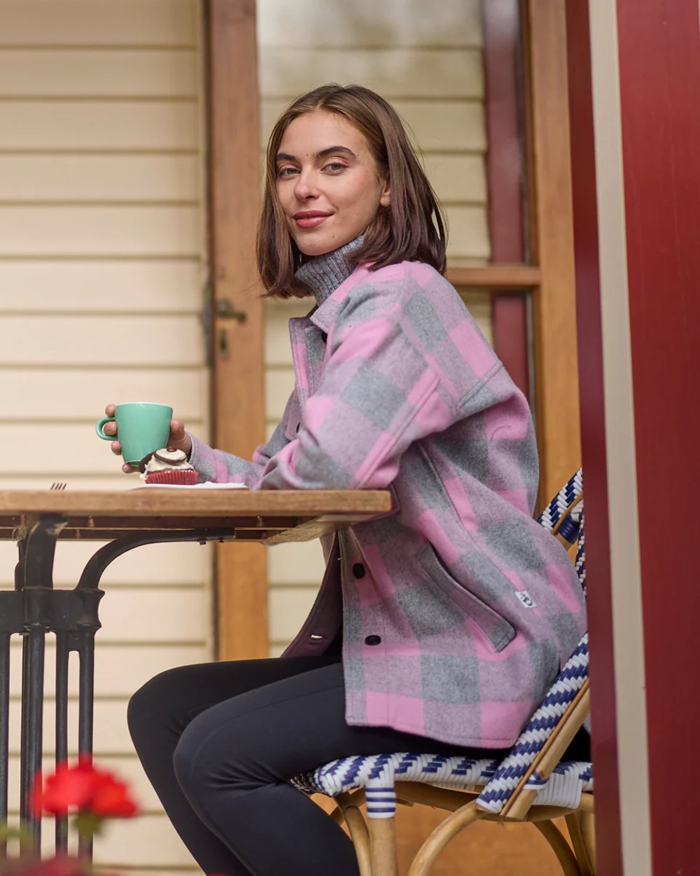 Rose Quartz Check Coloured Swanndri Womens Anchorage V2 Wool Shirt Jacket on restaurant background