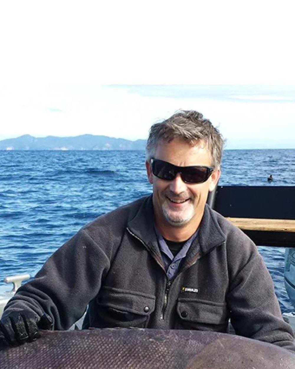 Black Coloured Swazi Back 40 Shirt on sea background